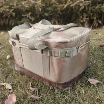 High-strength camping storage bag with multiple hooks on grass background.