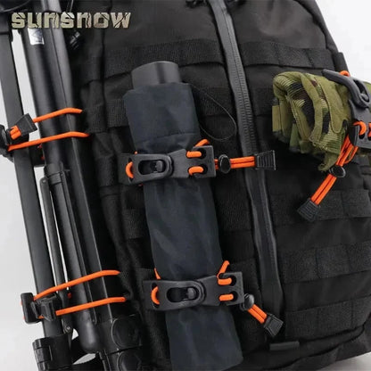 Multi-Purpose MOLLE Webbing Buckle Clip securing gear on tactical backpack.