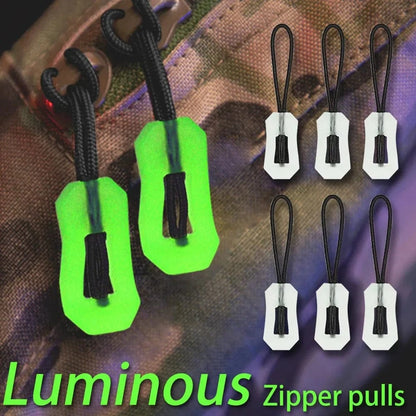 Glow-in-the-dark zipper pulls for safety and convenience on outdoor gear.