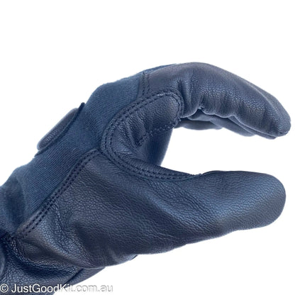 Tactical glove in black Kevlar and aniline goatskin leather, showing reinforced palm and fingers.