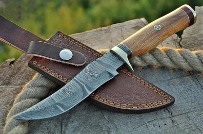 Damascus Steel Hunting Knife with handcrafted hammer-forged blade and detailed pattern, leather sheath included.