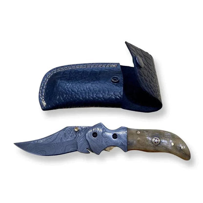 Damascus Steel Folding Knife with Ram White Horn handle and crocodile leather sheath.
