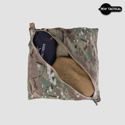Camouflage mesh storage bag with diagonal zipper and toggle, ideal for tactical or everyday use.