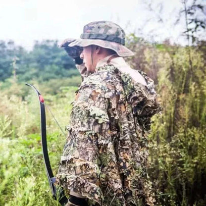 Camouflage Ghillie Suit in green terrain for hunting or Airsoft.